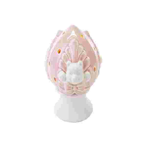 Immagine di un pumo in porcellana rosa a forma di orsetto.
